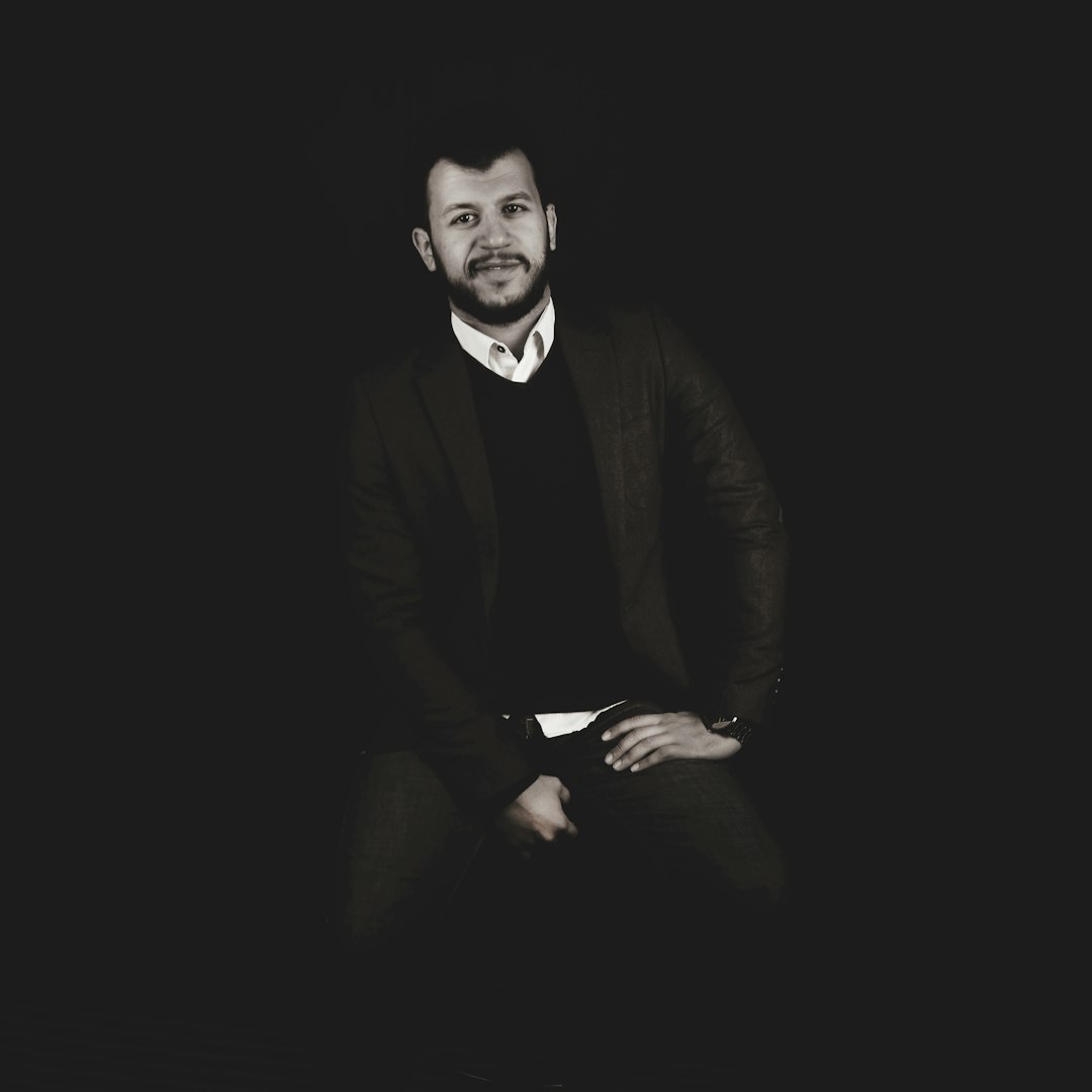 Professional portrait of a man with beard in business casual