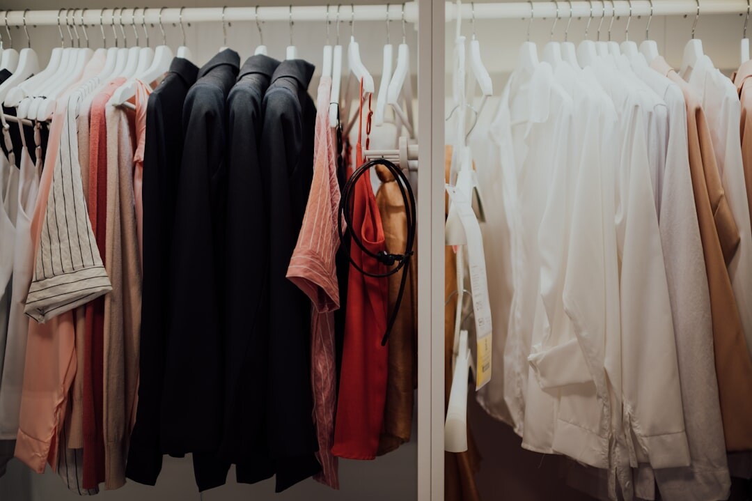 Neatly organized wardrobe with folded clothes and hanging items